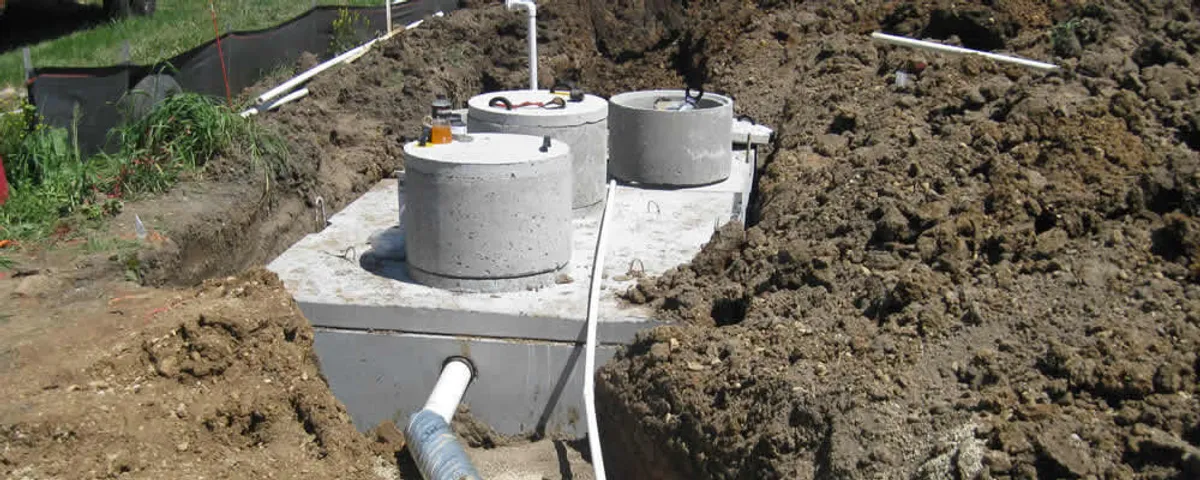 Septic system repair and installation site with tank access ports in Kansas City, KS